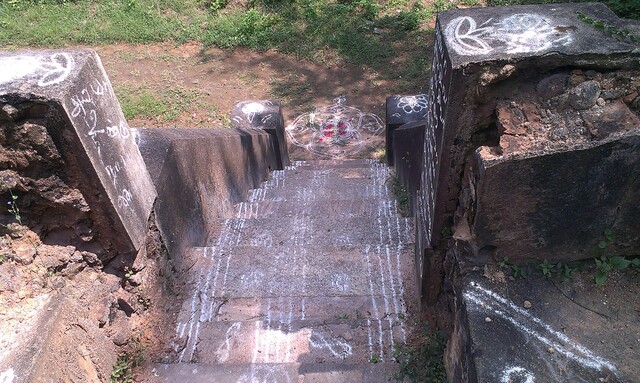 Picture shows a stairway made of stone with patterns drawn in chalk