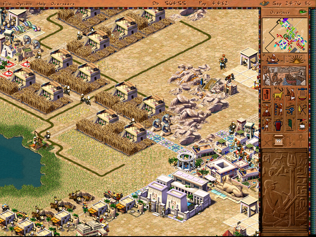 A screenshot from the game 'pharoah' showing grain farms supplied by canals.